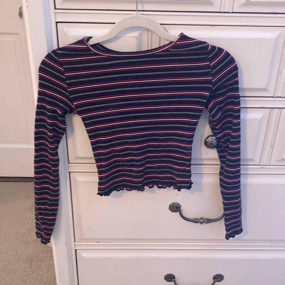 Cropped blue long-sleeve shirt with red, white and yellow stripes from GARAGE